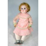 A Jules Steiner bisque-headed girl doll with plaited blond wig,