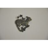 A silver brooch by Georg Jensen, in the form of a skipping lamb overlaid with ivy, 5 cm x 5 cm,