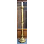 An Italianate carved giltwood torchere, on circular base,