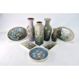 A collection of Stuart Bass studio pottery decorated with wild flowers,