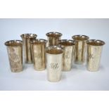AMENDMENT - EIGHT A set of six US Sterling plain tapering beakers with flared rims,