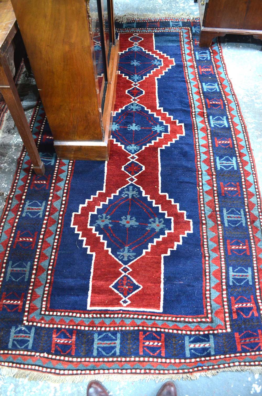 A Turkish long rug, dark blue/red