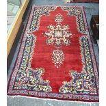 An Old Persian Ardekan rug, red ground,