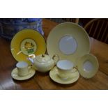 A Wedgwood yellow ground tea and coffee service with gilt handles and dash gilt edge/rim decoration,