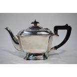 A heavy quality silver teapot of oblong form with canted corners, on flared foot rim,