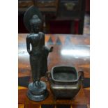 Two items of metalwork, comprising: a standing figure of The Historical Buddha,