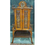 A late Victorian patented walnut music cabinet,