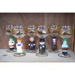 A set of six hock glasses, the bowls having a wide gilt band etched with grape and vine,