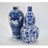 Two blue and white vases: one of gourd form and one of approximately meiping form;