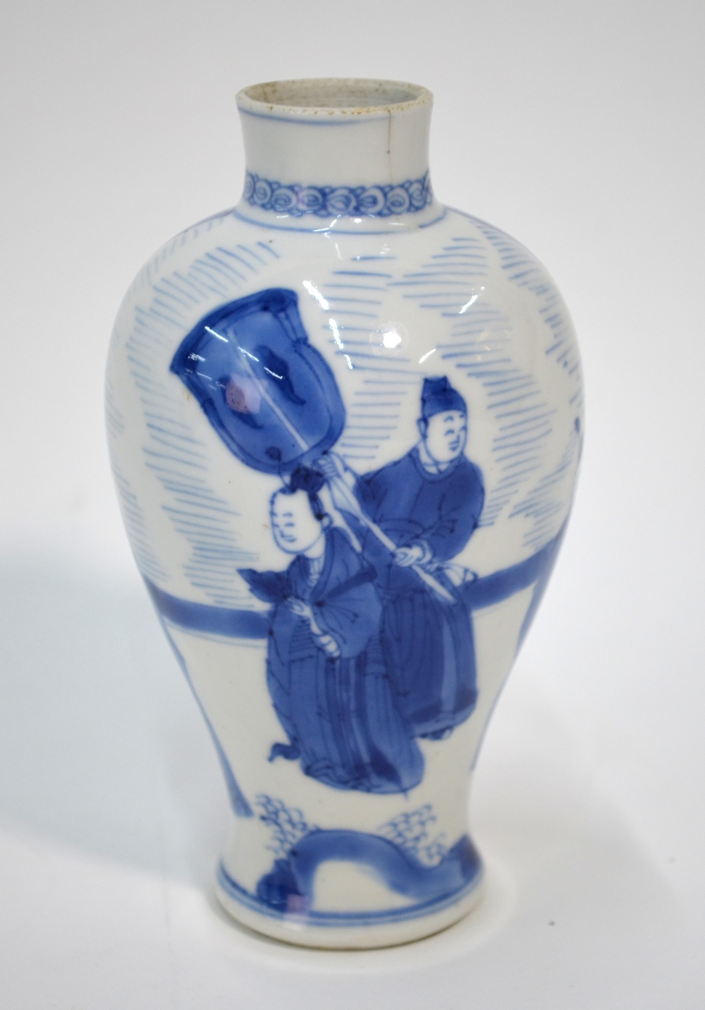 A Chinese small blue and white vase, decorated with scholars and a flower arrangement, 13 cm high,