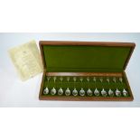 A cased set of twelve silver Royal Horticultural Society Flower Spoons with embossed gold finials,