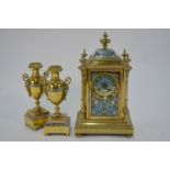 Henry Marc, Paris - A late 19th century champleve enamelled lacquered brass clock garniture,