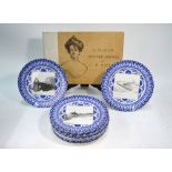 Eleven Edwardian Royal Doulton blue and white plates decorated to the centre with a square reserve
