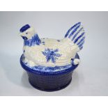 A blue and white pottery soup tureen, the base in the form of a basket,