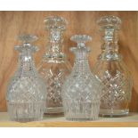 A pair of heavy Georgian style cut glass decanters, 28 cm high to/w a pair of smaller examples, 21.