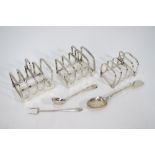 A small pair of silver toast-racks, Sheffield 1926, to/w a similar single toast-rack,