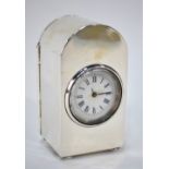 A late Victorian dome-topped silver boudoir clock with 3 cm enamel dial, on bun feet,