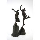 A classical French bronze figure raised on a cylindrical green marble plinth, 24 cm high overall ,