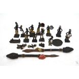 A small collection of African cold-painted iron tribal figures to/w two stabbing-sticks (box)
