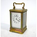 A French brass cased 8-day single train carriage clock with white enamelled dial (cracked),