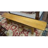 A Batheaston oak refectory trestle bench, originally supplied by Wessex Farthingale Ltd.