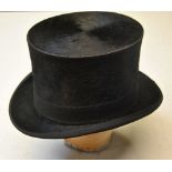 A black silk top hat retailed by Christys', London, 58 cm circ.