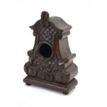 A 19th century French Rococo-style watch-stand, carved from a single piece of wood,