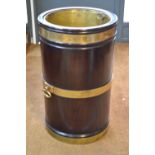 A substantial George III style oversize brass bound mahogany peat bucket,
