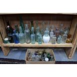 Of local Interest - a collection of old glass bottles including Sweppes 'By Appointment to the King