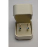 A pair of blue topaz and eight cut diamond earrings,