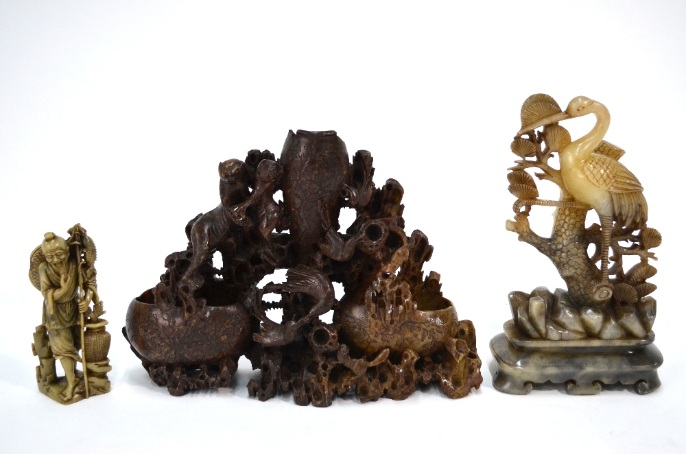 Three pieces of Chinese soapstone, comprising: a standing figure of a Fisherman,