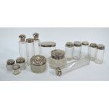 A collection of fifteen various silver-topped cut glass toilet bottle and jars (box)