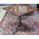 A 19th century mahogany tilt top tripod table, the square top raised on a turned pillar to pad feet,