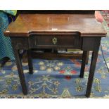 An 18th century oak gateleg tea table, the fold-over top over a frieze drawer,