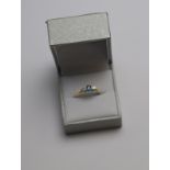 An oval blue topaz and brilliant cut diamond three stone ring,