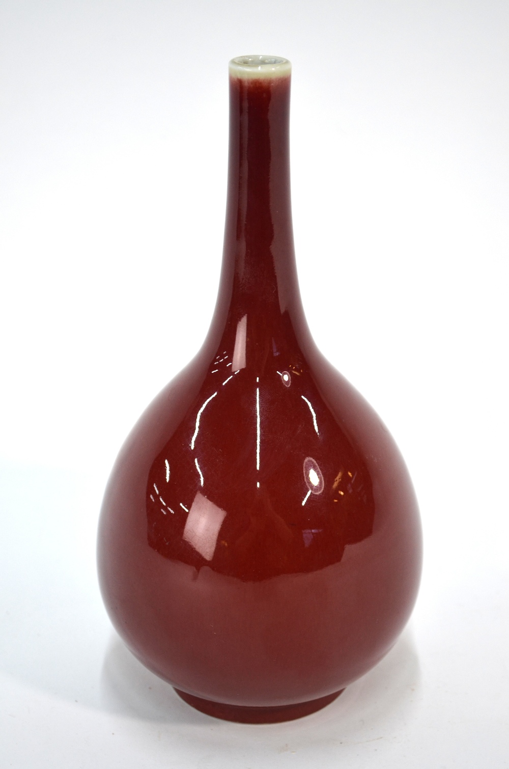 A Chinese sang-de-boeuf/langyao style monochrome bottle vase with typical,