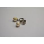A pair of diamond set cluster hoop earrings having detachable pearl and diamond set drop,