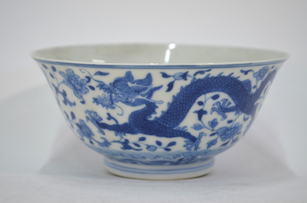 A Chinese set of three blue and white bowls; - Image 4 of 5