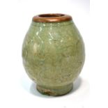 A Chinese celadon vase with copper mounted rim, decorated with a bold floral design, 17.