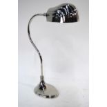 A nickel plated desk lamp with shell shaped shade