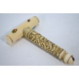 A Japanese, unusual ivory and shibayama-style, mounted corkscrew,