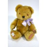 A Chad Valley gold plush teddy bear with musical movement,