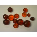 A quantity of loose amber beads, various sizes,