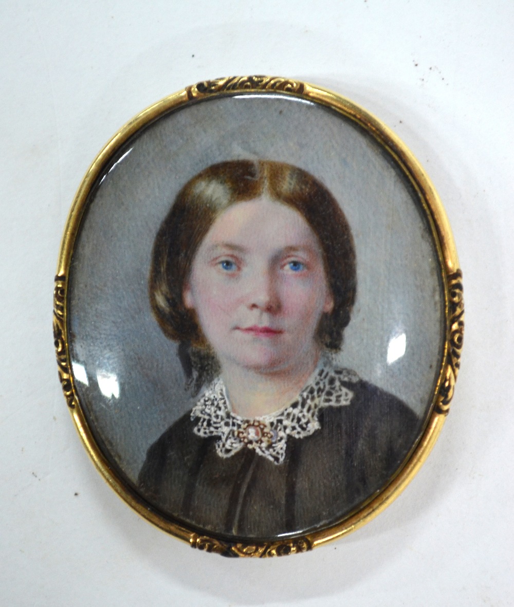 A Victorian oval portrait miniature on ivory of a young lady in mourning clothes; unsigned, - Image 2 of 3