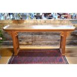 An antique Chinese elm high altar table, the single wide plank top over a fret cut cloud frieze,