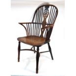 A 19th century yew wheel and hoop back Windsor elbow chair with elm seat,