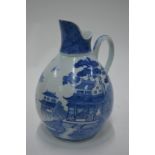 An unusual Chinese Export blue and white ewer with loop handle,