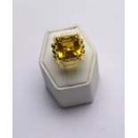 A square baguette cut citrine ring in ornate claw setting on triple shank,