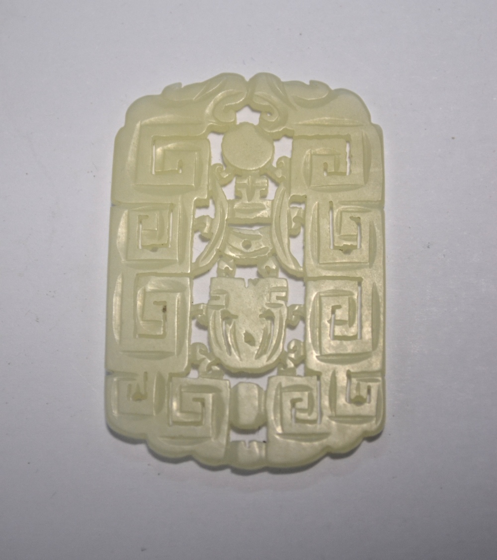 A Chinese green jade pendant of whitish hue, - Image 5 of 7