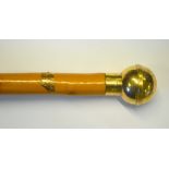 A 9ct gold topped walking stick having spherical top engraved '....